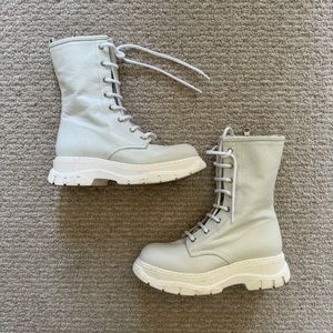 White leather lace up combat boots with lug sole
